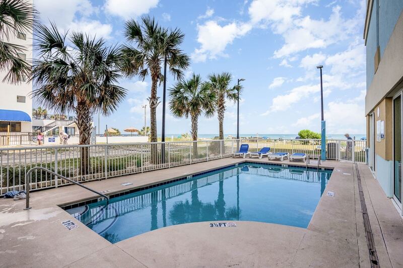 Second outdoor pool beside palm trees
